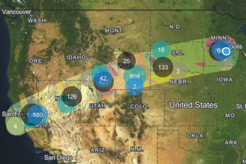 Screenshot of the Flyover Country app shows several dots indicating points of interest beneath a flight path over a satellite image of the United States